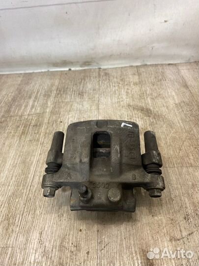 Суппорт задний левый Mitsubishi Lancer 10 CY3A