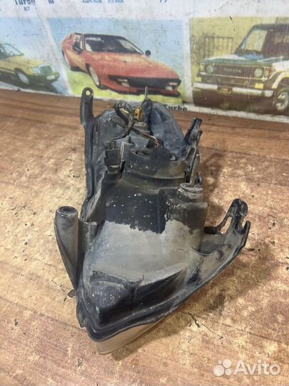 Фара левая оригинал Мазда Трибьют