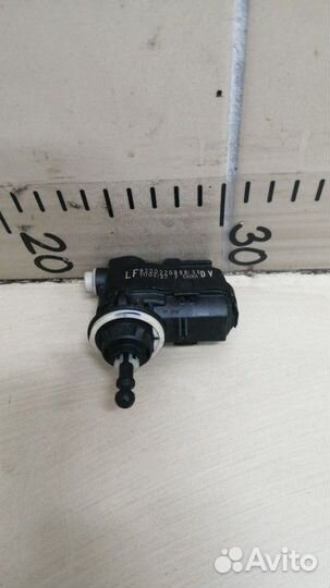 Моторчик корректора фары Nissan Almera