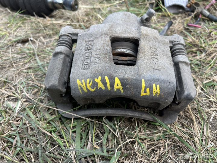 Тормозной суппорт Daewoo Nexia передний