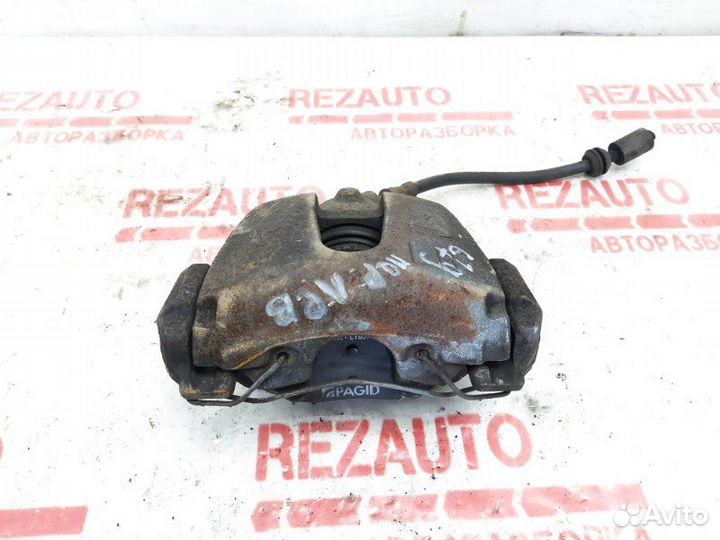 Суппорт тормозной передний левый Ford Focus CB4