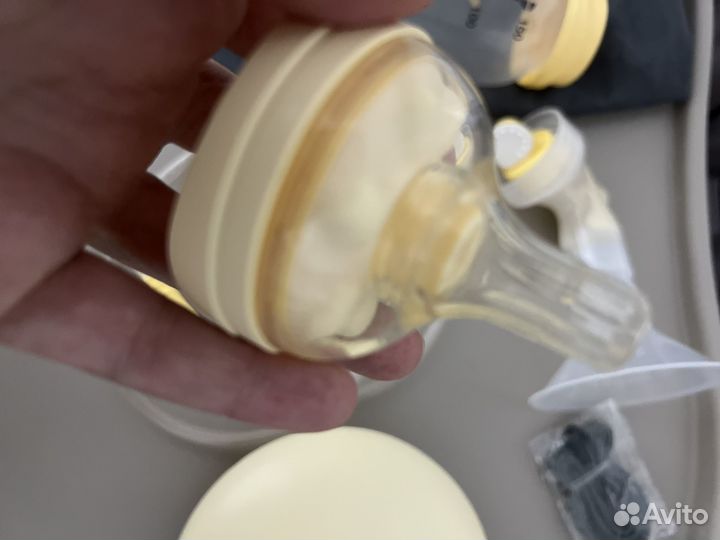 Молокоотсос medela электрический