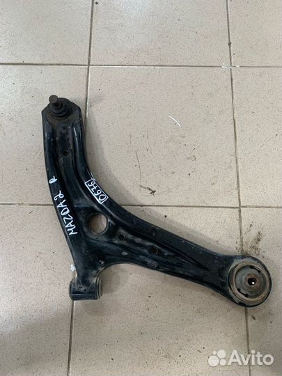 Передний нижний правый рычаг Mazda 2 0676
