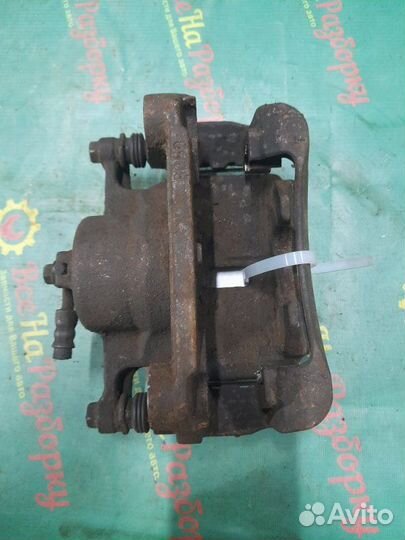 Суппорт передний левый Nissan Qashqai