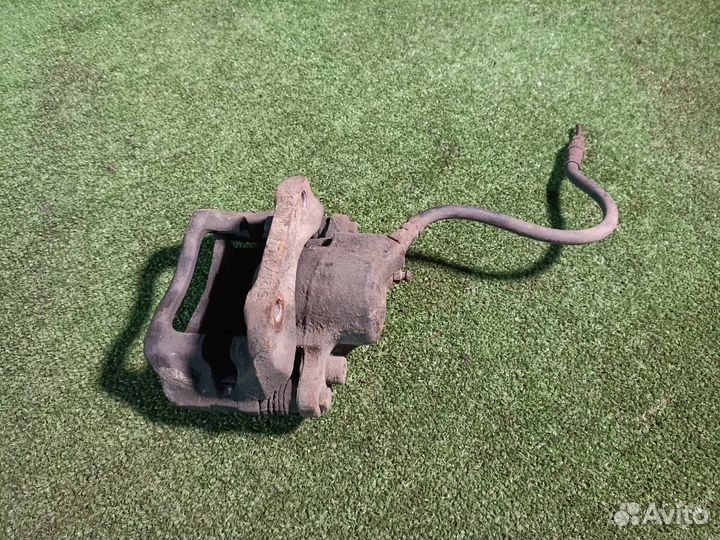 Тормозной суппорт передний левый Renault Logan