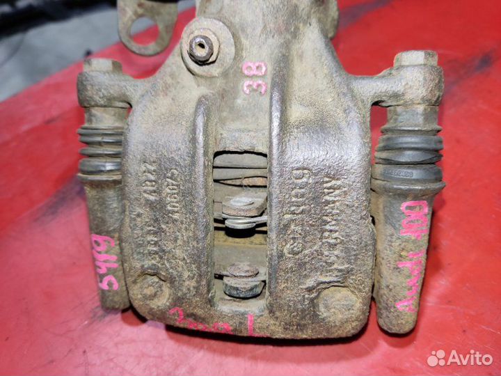 Суппорт задний левый Audi 100 седан 2.5 AAT 1991