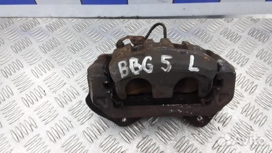 Суппорт тормозной передний левый mitsubishi L200 K