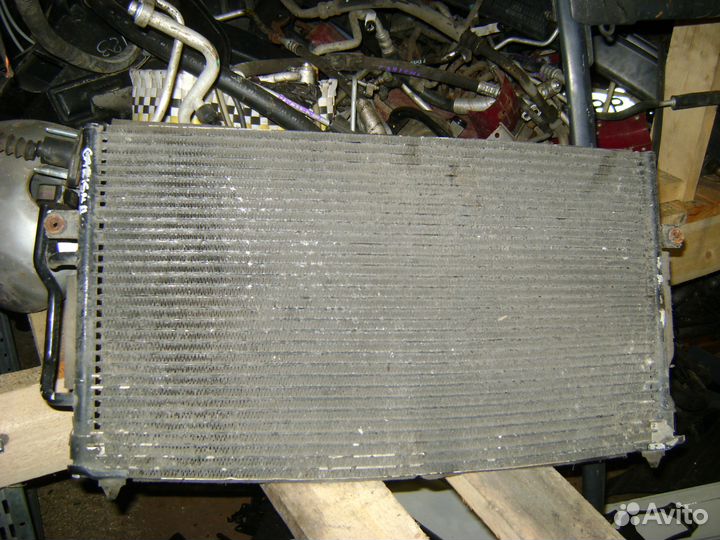 Радиатор кондиционера Mitsubishi Carisma Каризма