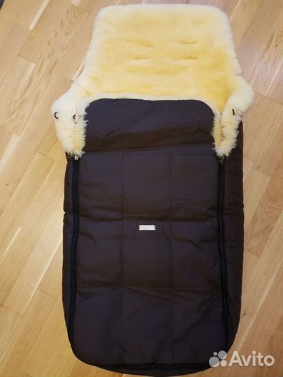 Меховой конверт в коляску фирмы Christ