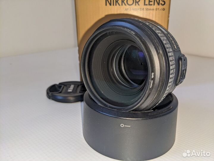 Объектив Nikon 50mm и рюкзак-слинг и чехол