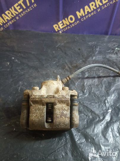 Суппорт тормозной передний левый Renault Logan LS