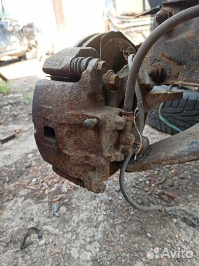 Суппорт передний правый Mitsubishi Lancer 9