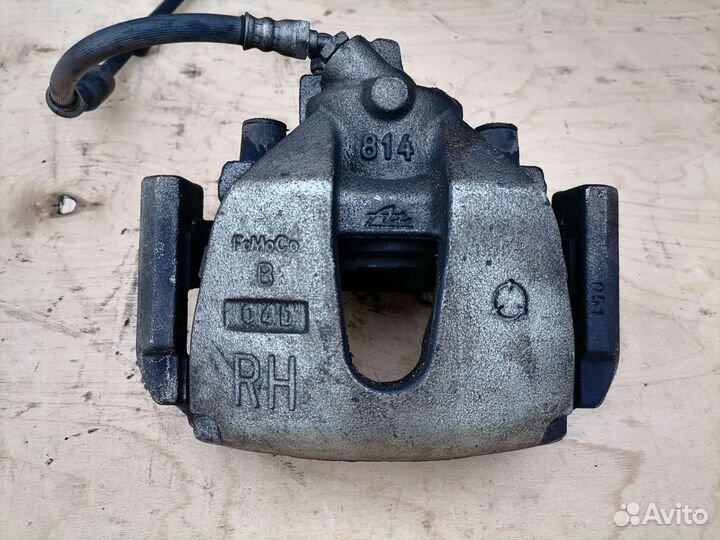 Передний тормозной суппорт Мазда 3