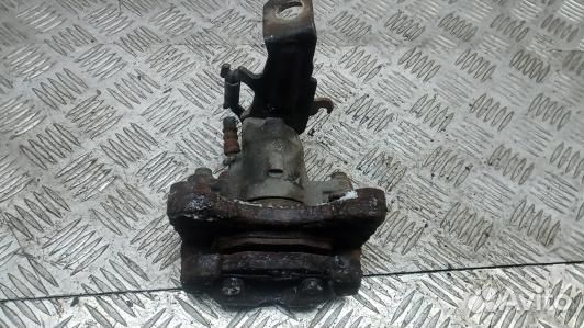 Суппорт тормозной задний левый nissan almera tino