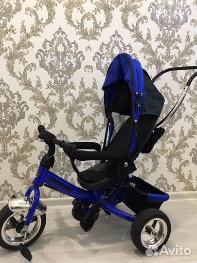 Детский трехколесный велосипед с крышей