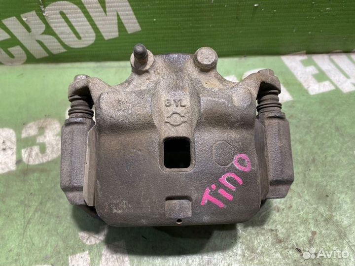 Суппорт тормозной передний правый Nissan Tino