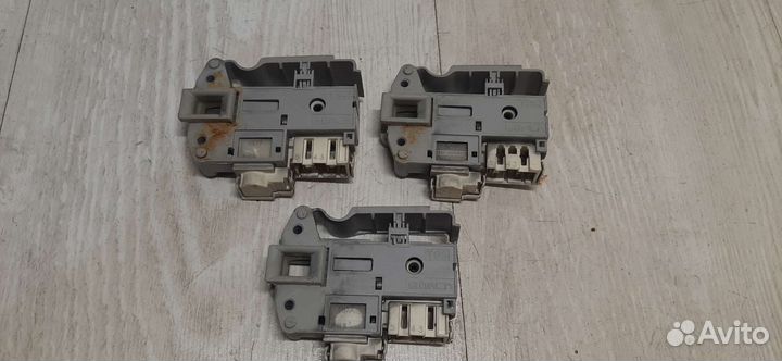 Устройство блокировки(замок) люка для сма Ariston