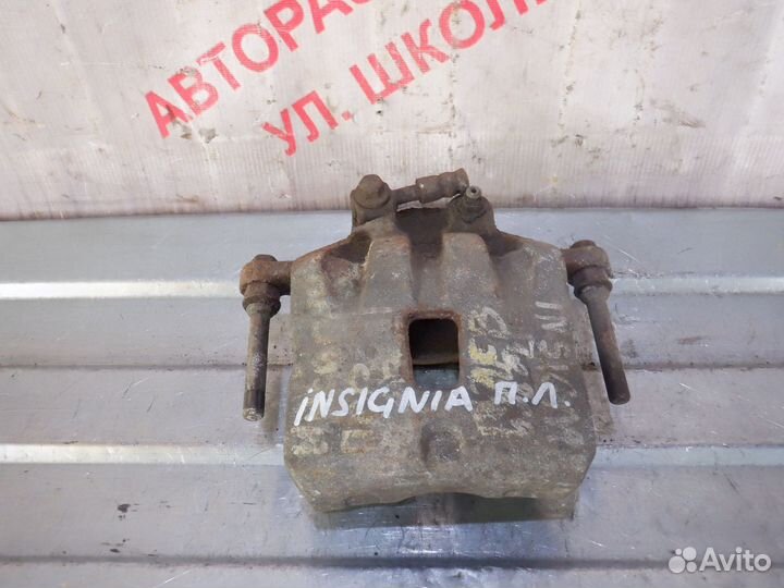 Суппорт тормозной передний левый Опель Инсигния