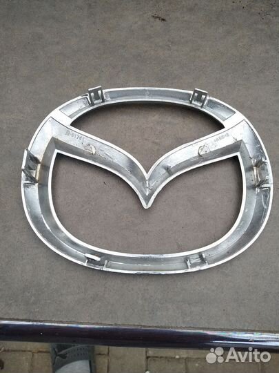 Эмблема мазда