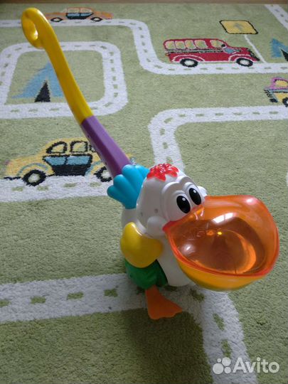 Свето-музыкальная игрушка каталка