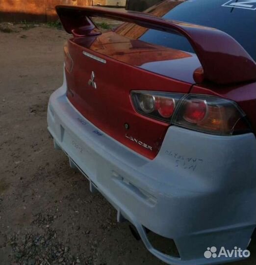 Задний бампер Mitsubishi Lancer 10