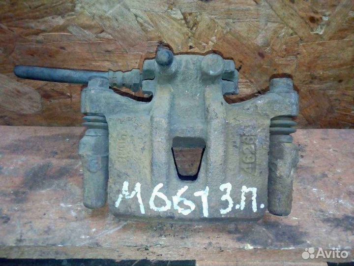 Суппорт задний левый Mitsubishi Grandis NA 2.4