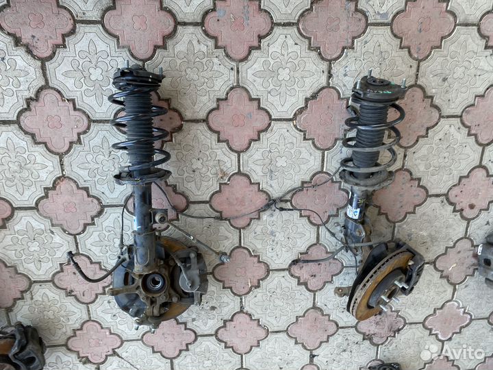 Стойка амортизатора передняя Hyundai Tucson 3