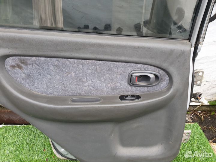 Обшивка двери задней левой Kia Spectra