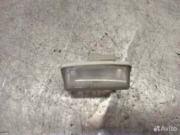 Фонарь подсветки номера левый Toyota Corolla E12