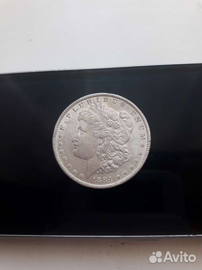 Серебряный доллар 1884 год