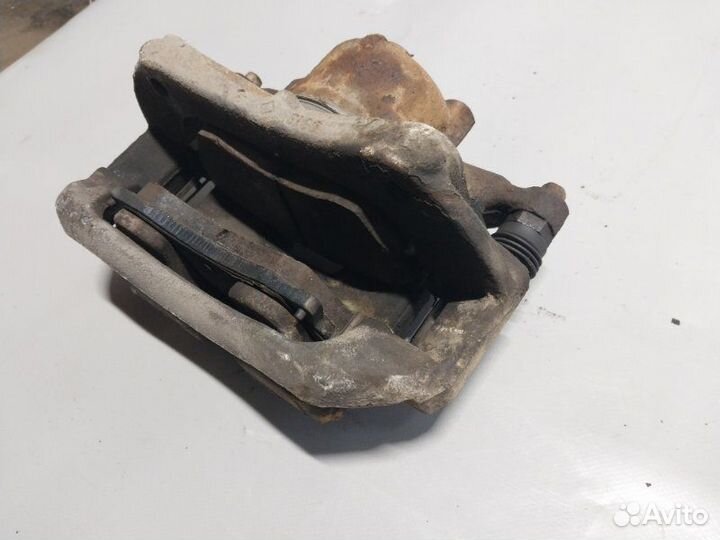 Суппорт тормозной передний левый Chevrolet Cruze