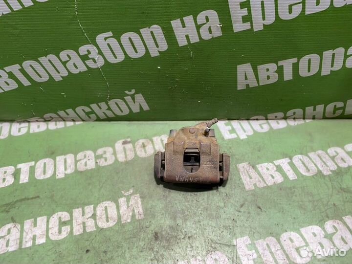 Суппорт тормозной передний левый Kia Shuma