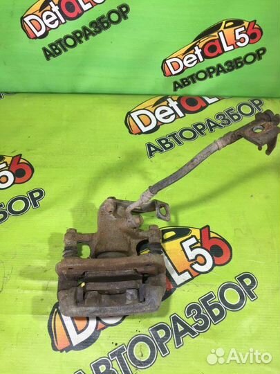 Суппорт тормозной задний левый Kia Rio 3