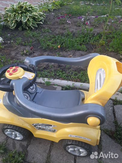 Детская машинка каталка с музыкой