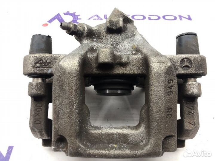 Суппорт тормозной задний левый Mercedes C-Class