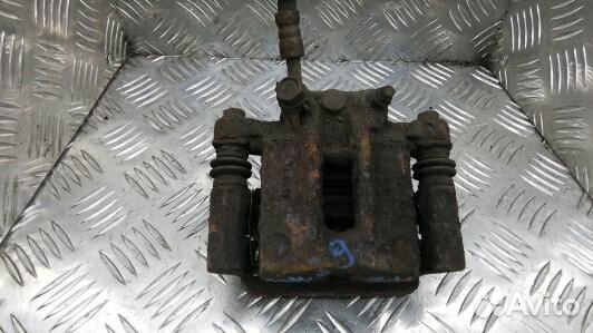 Суппорт тормозной задний левый toyota corolla E12