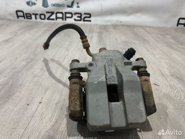 Суппорт тормозной задний правый Toyota Rav4 ACA33