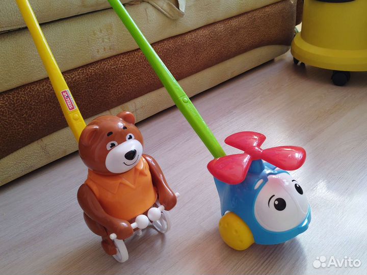 Игрушка каталка с ручкой