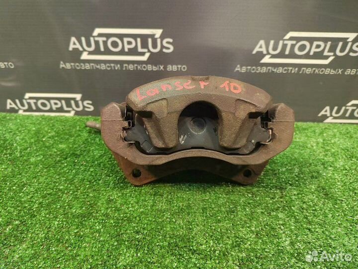 Суппорт передний правый Mitsubishi Lancer X седан