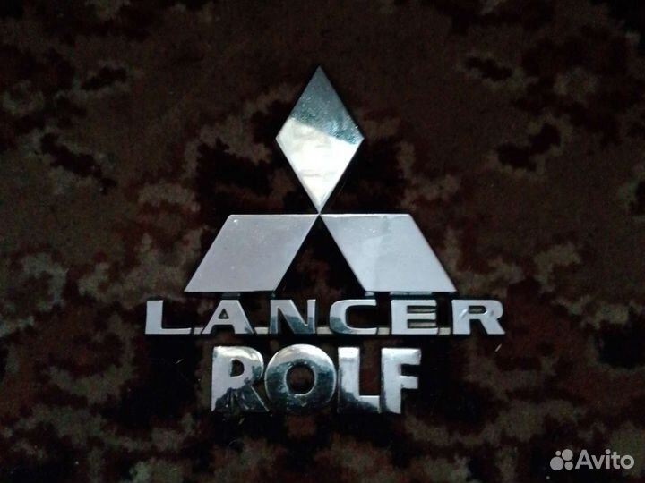 Эмблема mitsubishi lancer 9