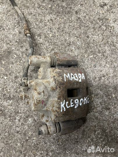 Суппорт передний левый Mazda Xedos