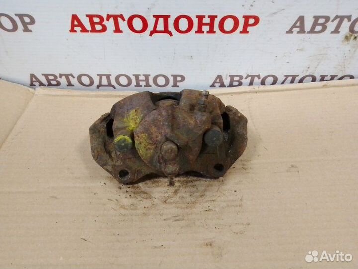 Суппорт тормозной передний левый Opel Zafira A