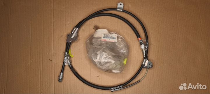 Трос стояночного тормоза левый Toyota lexus camry