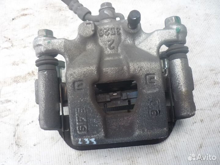 Суппорт тормозной задний LH/RH Nissan Teana L33