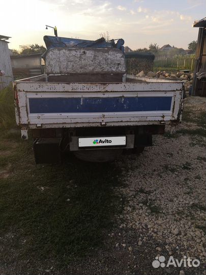 Nissan Atlas с КМУ, 2004