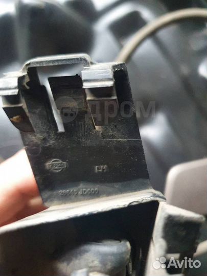 Форсунка омывателя фар левая