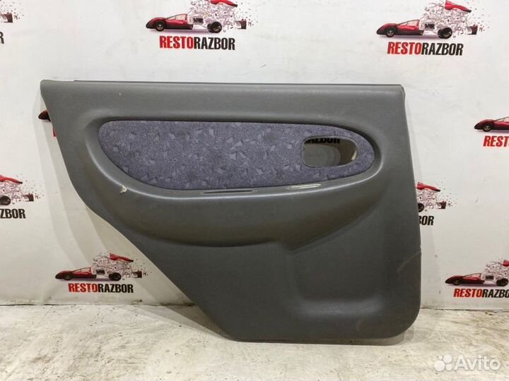 Обшивка боковой двери задняя левая Kia Spectra