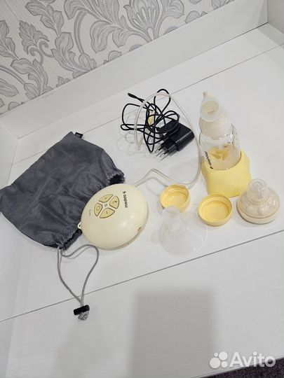 Молокоотсос medela электрический