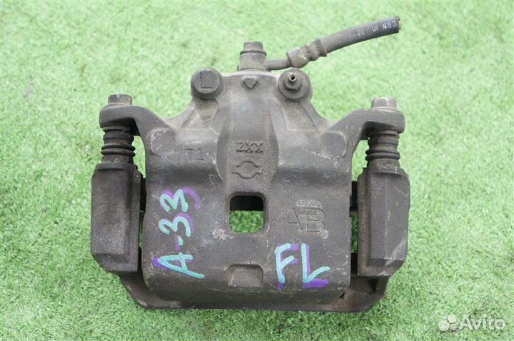 Суппорт передний левый Nissan Cefiro A33 QR20DE