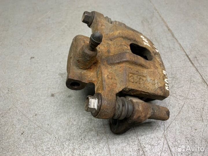 Тормозной суппорт задний левый Mitsubishi Lancer 9